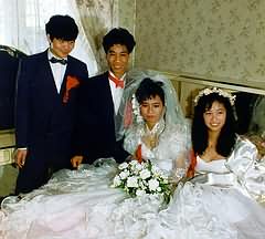 Bride and friend on bed