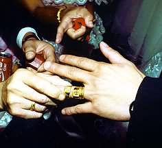 Groom receives gold rings