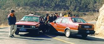 Chinese taxis collide on bend.