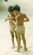 Two youngsters inspect sweets.