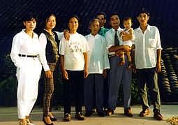 Farmer's family pose for photo.