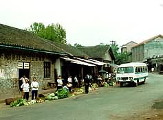 Farmers sell produce on street.