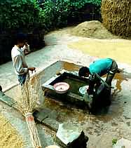 Washing hands by water pump